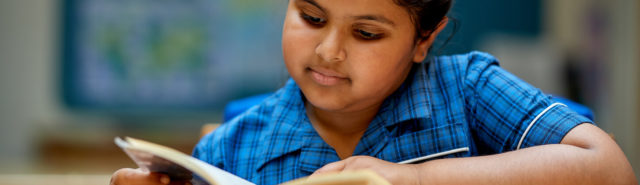 nottingham girls' high school pupil reading a book