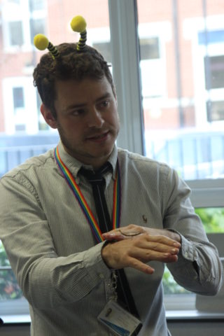 Biology Teacher Mr Leeman wearing a fetching pair of Bee deely boppers with a centipede on his hand