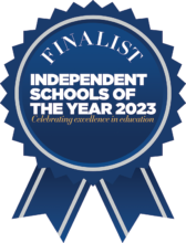 Blue rosette with the words "Finalist Independent Schools of the Year 2023 Celebrating Excellence in Education
